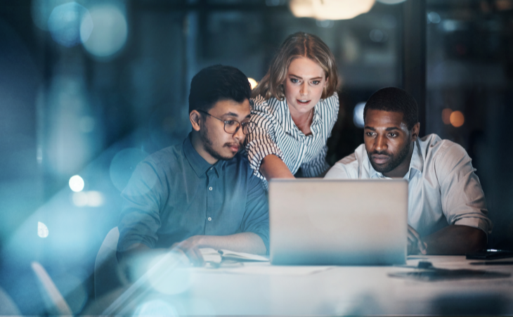 Three technology professionals at work 